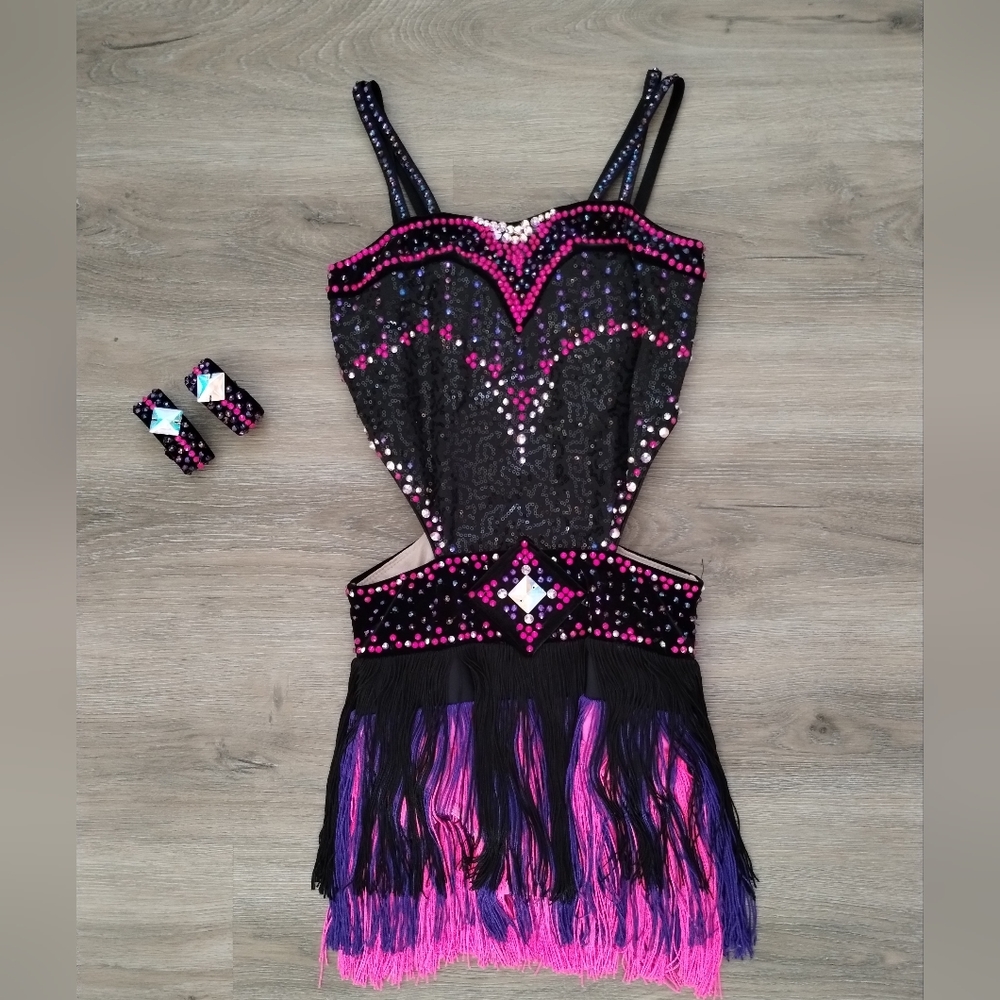 Black, pink, and purple fringe junior Latin ballroom costume.